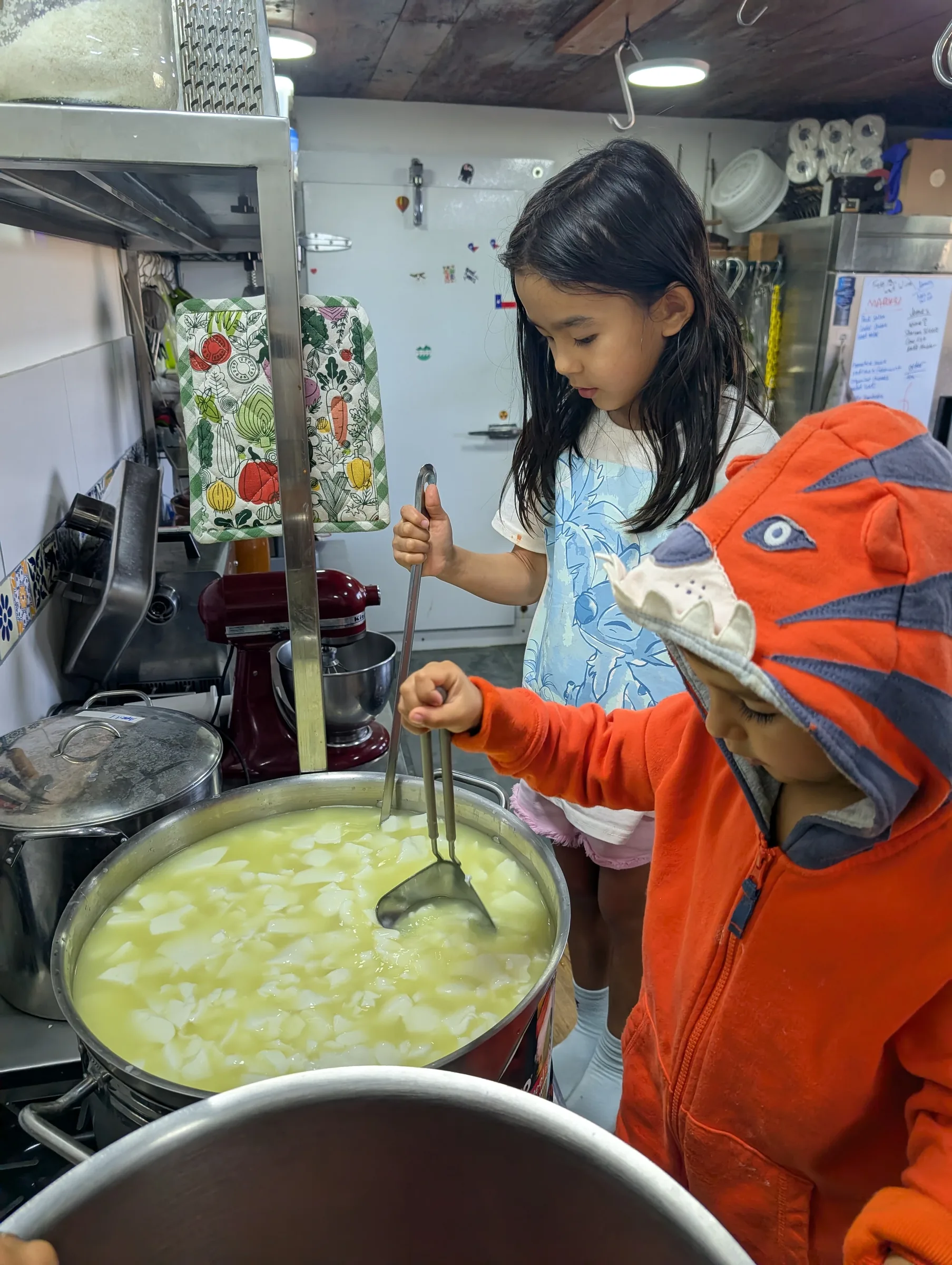 Kids making cheese at Finca 588
